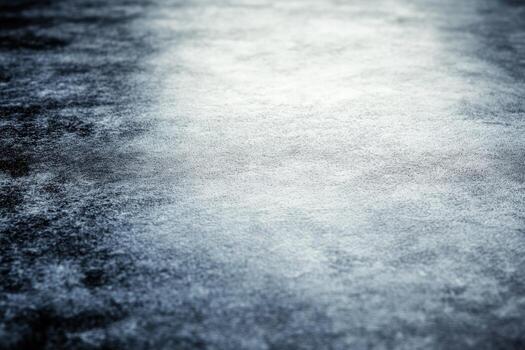 Smooth textured surface reflecting light in an abstract design from a lower angle during daylight photo