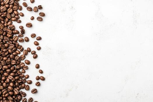 Coffee beans scattered on a clean surface create an inviting atmosphere for brewing photo