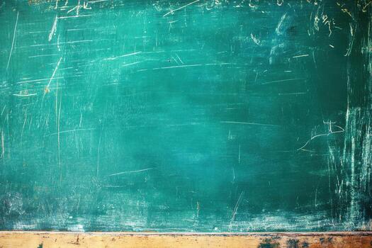 Chalkboard with scratches and marks in a classroom setting during a school day photo