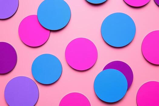 Colorful circular shapes scattered on a pink background for vibrant artistic display photo