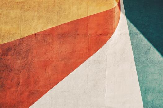 Colorful abstract mural design on a wall in an urban setting during daylight hours photo