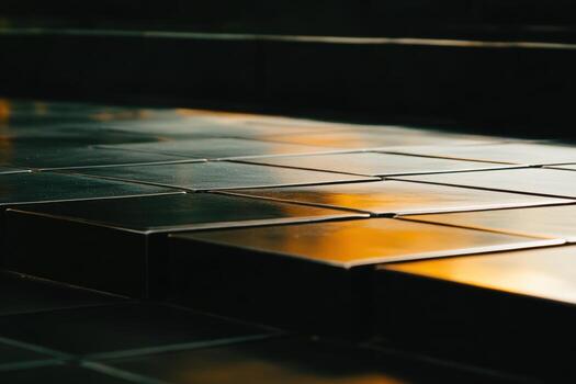 Reflective metal tiles creating an abstract pattern during sunset light photo
