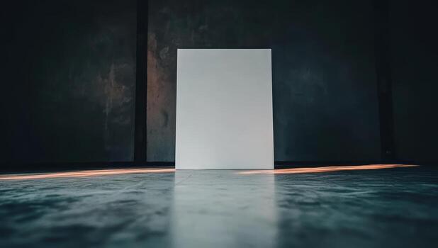 Blank canvas sitting on a polished floor illuminated by soft light photo