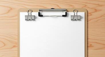 Clipboard with blank paper and binder clips on wood photo