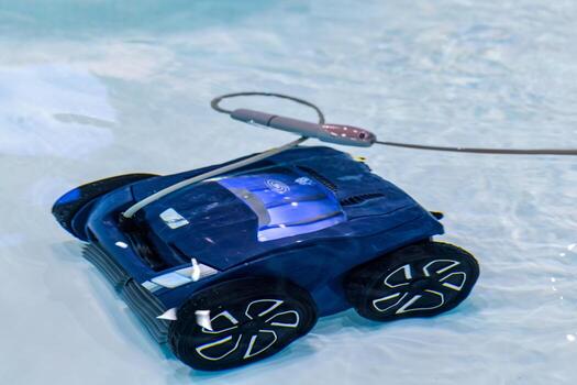 Robotic pool cleaner navigating water surface with sleek design and efficient functionality photo
