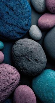 A close up of colorful stones on a black surface photo