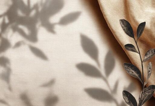 A leaf on a fabric with a shadow photo