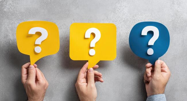 Hands holding question marks with different colors photo