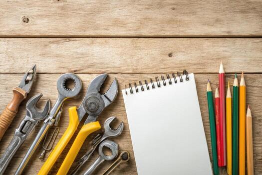 Tools and pencils on a wooden table photo