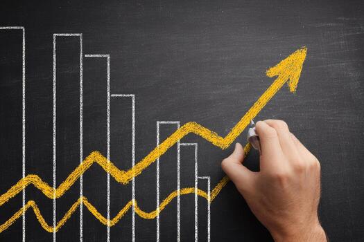 Hand drawing a graph on a blackboard with a rising arrow photo