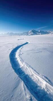 A long, thin, wavy line of snow photo