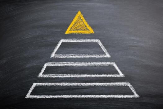 A pyramid with a yellow triangle on a blackboard photo