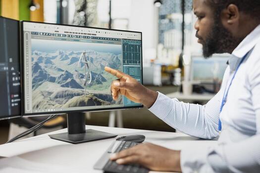 Close up of engineer analyzing advanced wind turbine models to improve efficiency and environmental performance. Designer creates innovative VAWT turbine in CAD software with higher clean energy yield photo