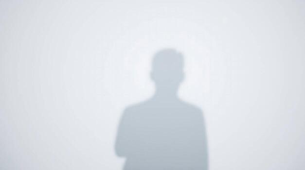 Mysterious silhouette of a businessman casting a shadow, evoking intrigue and professional presence in a clean, minimalist setting.AI Generate photo