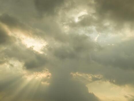 A large field with a large cloud in the sky photo