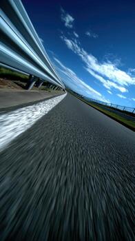 A blurry image of a road with a speed limit sign photo