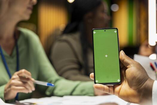 Coworkers team work late at night reviewing reports with copy space, analyzing trends and collaborating on strategy updates supported by visual data. Company projections with analytics. photo