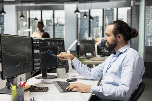 Risk analyst looking at candlestick charts interface to identify market volatility signs. Man looking over graphs on screen, reviewing portfolio performance reports, checking for financial risks photo