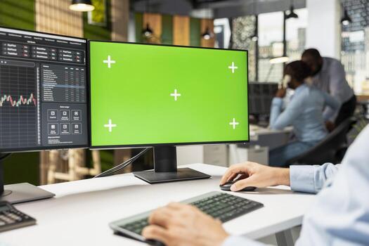 Close up of prop firm trader using mockup computer displaying candlestick graphs with stock market shares volatility. Brokerage company worker using trading platform on chroma key PC photo