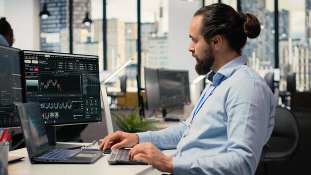 Trader in office leverages artificial intelligence on laptop to interpret charts, optimizing buying and selling. Stockbroker uses deep learning automatization on notebook to maximize profits photo