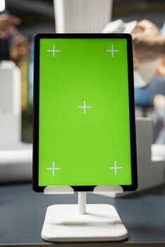 Close up of isolated green screen in an architect office space, 3D building models analyzed and studied for construction site preparation details. Infrastructure growth in a modern smart city. photo