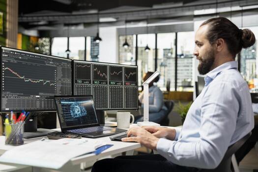 Trader running AI powered tools on laptop for automated trading and portfolio rebalancing. Man applying deep learning algorithms using notebook software to analyze complex market data photo