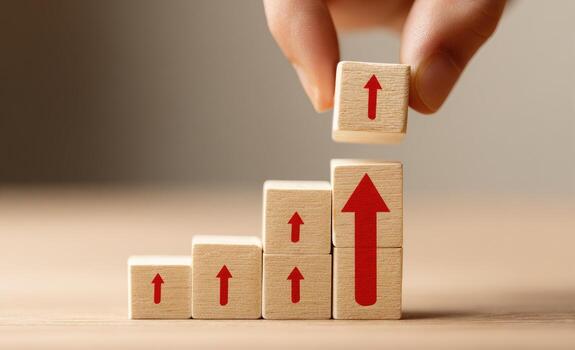 A person is placing wooden blocks with arrows on top photo