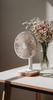 A desk fan with flowers on it photo