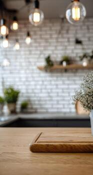 A wooden cutting board on a table in front of a wall photo
