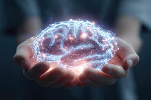 A person holding a glowing brain in their hands photo