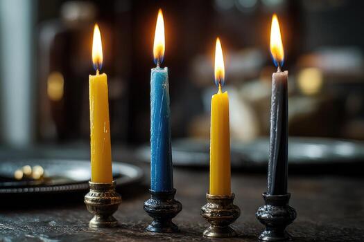 Three candles are lit on a table photo
