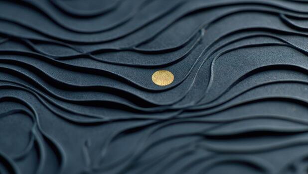 A close up of a gold coin on a black surface photo