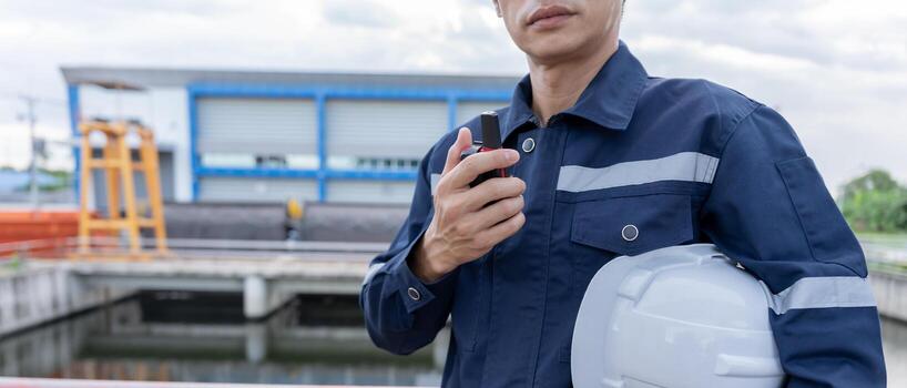 a maintenance and inspector. Maintenance engineers are using walky talky to inform the results of inspection of buildings and structures. Irrigation engineers are exploring sluice systems photo