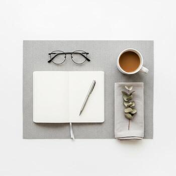 Minimalist Workspace with Coffee and Eucalyptus Branch photo
