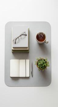 Minimalist Desk Setup with Tea and Notebook photo