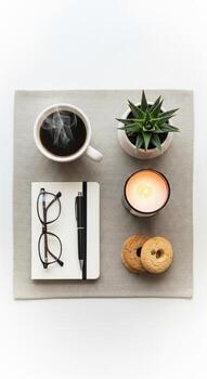 Cozy Workspace with Coffee, Candle, Cookies photo