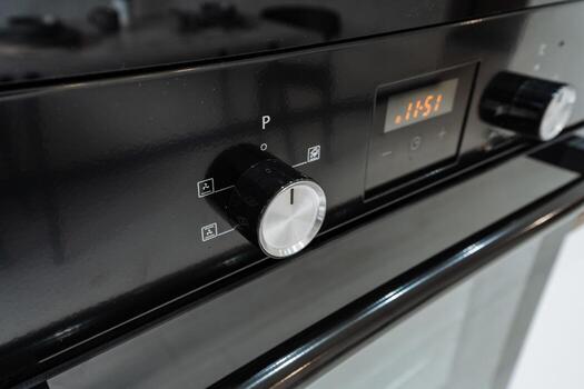 A clear view of the ovens knobs and display is crucial for precise temperature settings, enhancing the design and functionality of modern kitchen appliances for baking and cooking photo