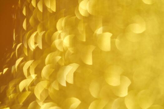 Abstract yellow bokeh effect with soft circular light patterns and warm golden glow. photo