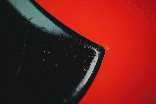 Close-up of a black and red abstract surface highlighting texture and color photo