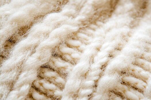 Textured beige wool knit fabric with intricate patterns for cozy apparel photo
