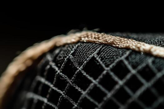 Close-up view of intricate mesh fabric with detailed stitching design photo