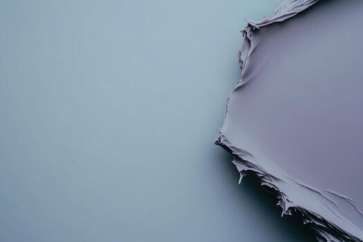 Soft gray paint texture on a wall with a fresh application in process photo