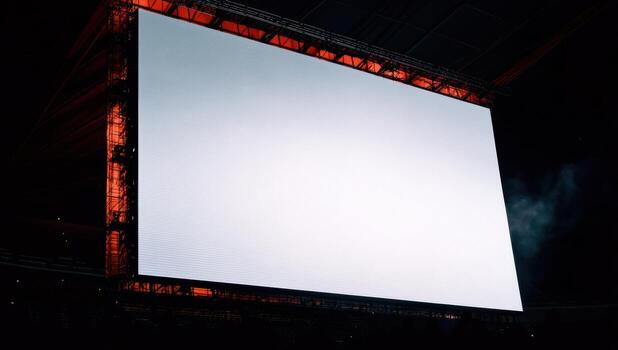 Large empty screen in modern stadium awaiting event in evening photo