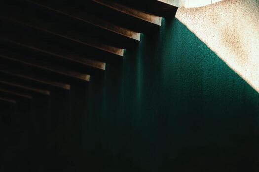 Light and shadow dance along textured walls in a serene setting photo