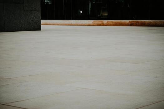 Smooth concrete surface in urban setting reflecting modern architecture photo