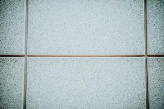 Textured wall panels in neutral tones create a modern backdrop photo