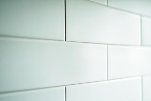 Glossy white subway tiles create a modern look in a stylish interior setting photo