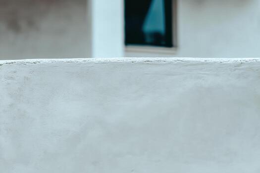 White wall with window backdrop in a minimalist architectural setting photo