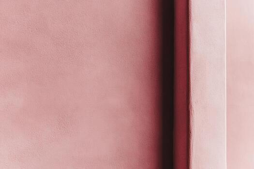 Soft pink wall texture creating a calming atmosphere in a modern space photo