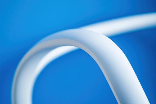 Abstract details of a white curve against a bold blue background photo